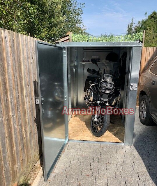 BMW R1250 GS Adventure stored inside an ArmadilloBoxes Fatboy Slim secure outdoor storage unit Caption