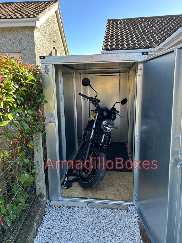 Kawasaki Z650 stored inside a bespoke 1100mm wide ArmadilloBoxes secure outdoor motorcycle storage unit