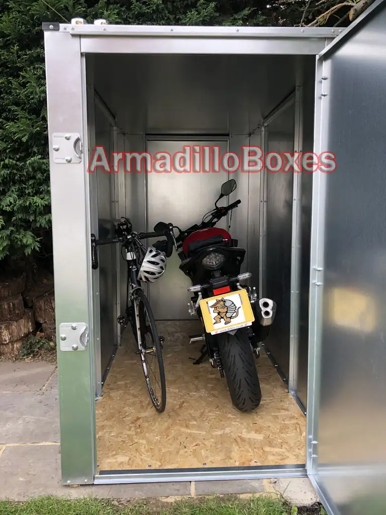 motorcycle shed with cycle and motorbike inside