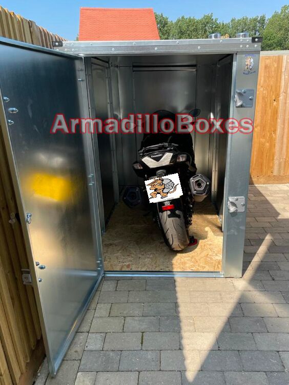 Kawasaki ZX1400 stored inside an ArmadilloBoxes secure outdoor motorcycle storage unit