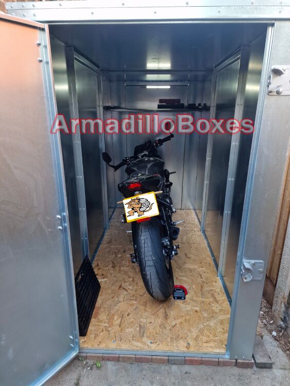 Triumph Street Triple 765 stored inside an ArmadilloBoxes secure outdoor motorcycle storage unit